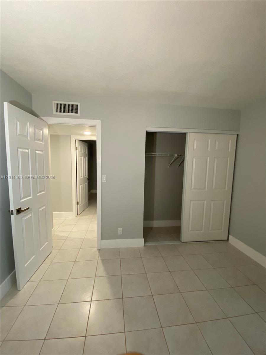 455 South Pine Island Road, Unit 110C Plantation, FL 33324 - Photo 18 of 30 a view of a livingroom with an empty space