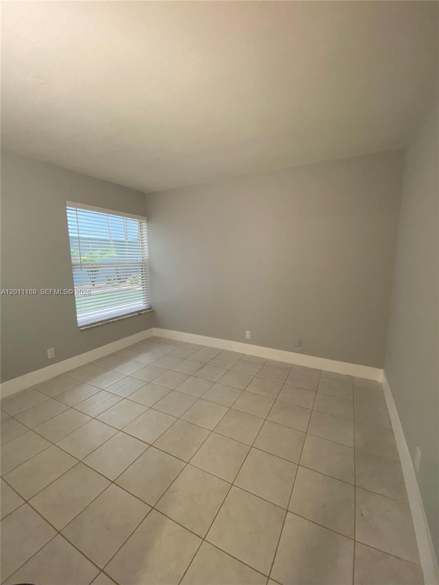 455 South Pine Island Road, Unit 110C Plantation, FL 33324 - Photo 19 of 30 an empty room with windows