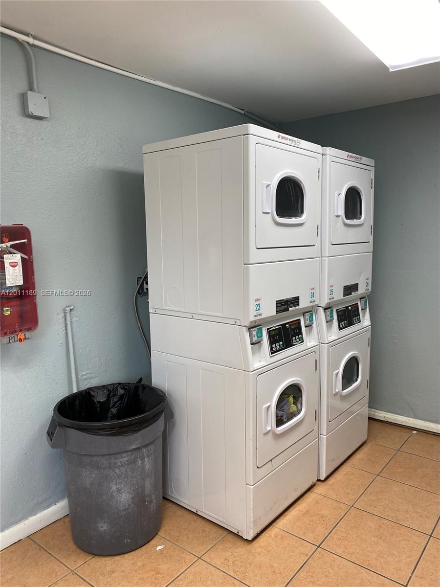 455 South Pine Island Road, Unit 110C Plantation, FL 33324 - Photo 26 of 30 a utility room with dryer and washer