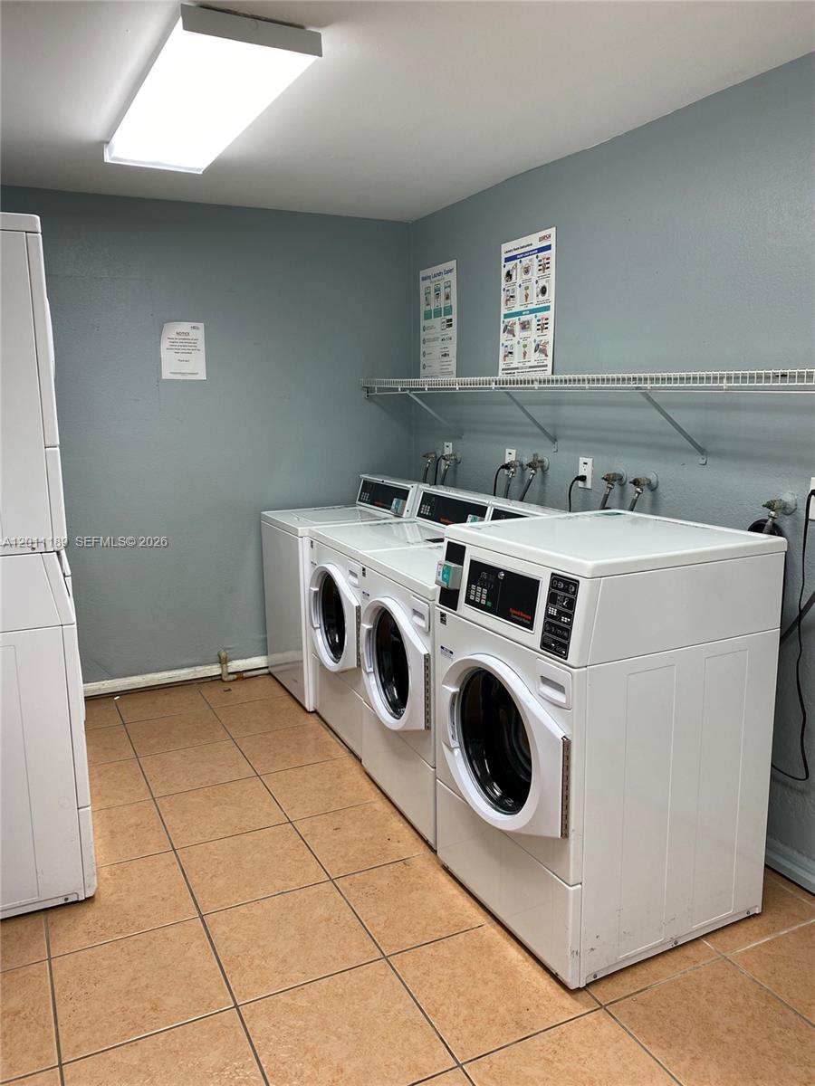 455 South Pine Island Road, Unit 110C Plantation, FL 33324 - Photo 27 of 30 a utility room with dryer and washer