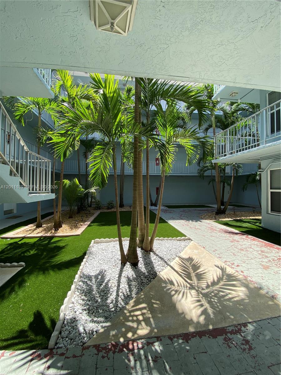 455 South Pine Island Road, Unit 110C Plantation, FL 33324 - Photo 29 of 30 a house with a yard and a fountain