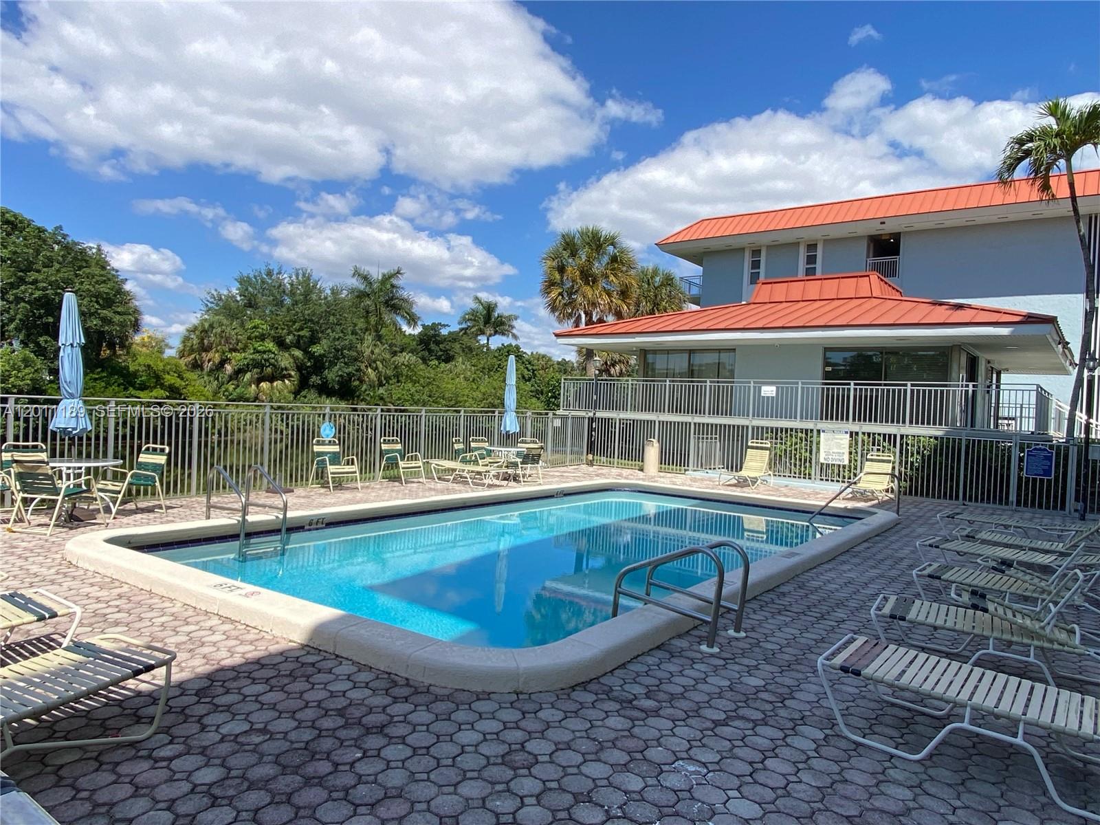 455 South Pine Island Road, Unit 110C Plantation, FL 33324 - Photo 30 of 30 a view of a house with swimming pool and sitting area