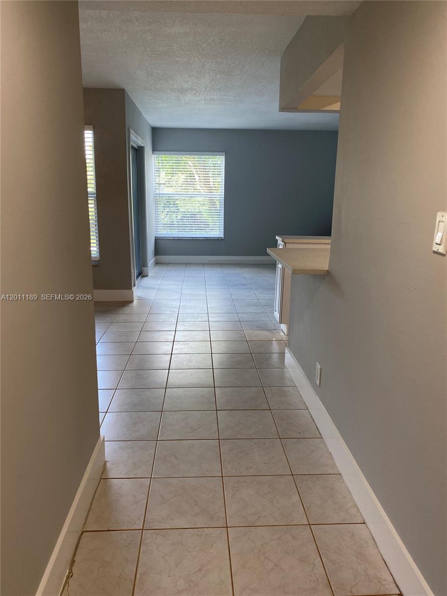 455 South Pine Island Road, Unit 110C Plantation, FL 33324 - Photo 3 of 30 a view of an empty room with a window