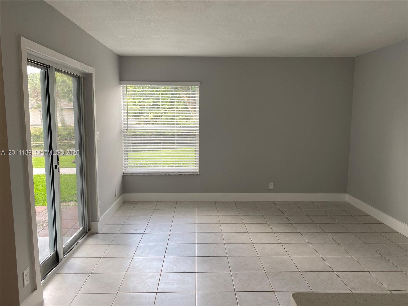 455 South Pine Island Road, Unit 110C Plantation, FL 33324 - Photo 8 of 30 a view of an empty room with a window