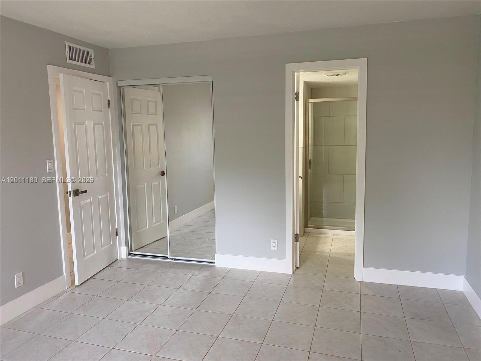 455 South Pine Island Road, Unit 110C Plantation, FL 33324 - Photo 10 of 30 an empty room with closet and a bathroom
