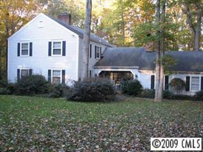 2816 High Ridge Road Charlotte, NC 28270 - Photo 1 of 8 a front view of a house with a yard and garage