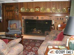 2816 High Ridge Road Charlotte, NC 28270 - Photo 6 of 8 a fireplace with glass top