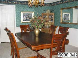 2816 High Ridge Road Charlotte, NC 28270 - Photo 7 of 8 a view of a dining room with furniture and chandelier