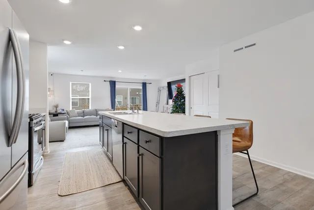 a kitchen with counter top space and stainless steel appliances