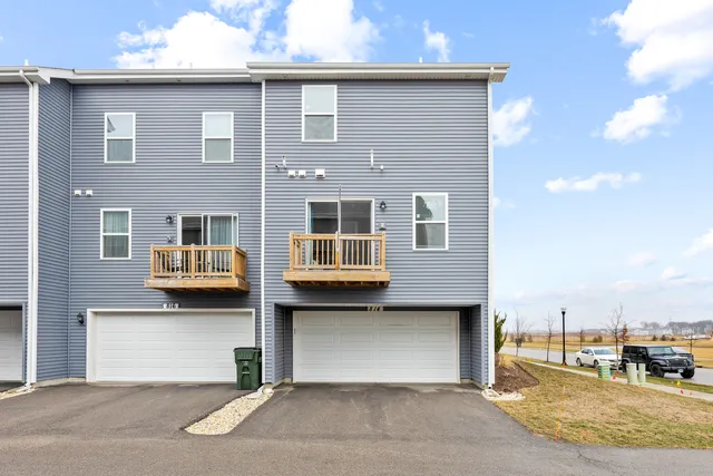 a front view of a building with parking space