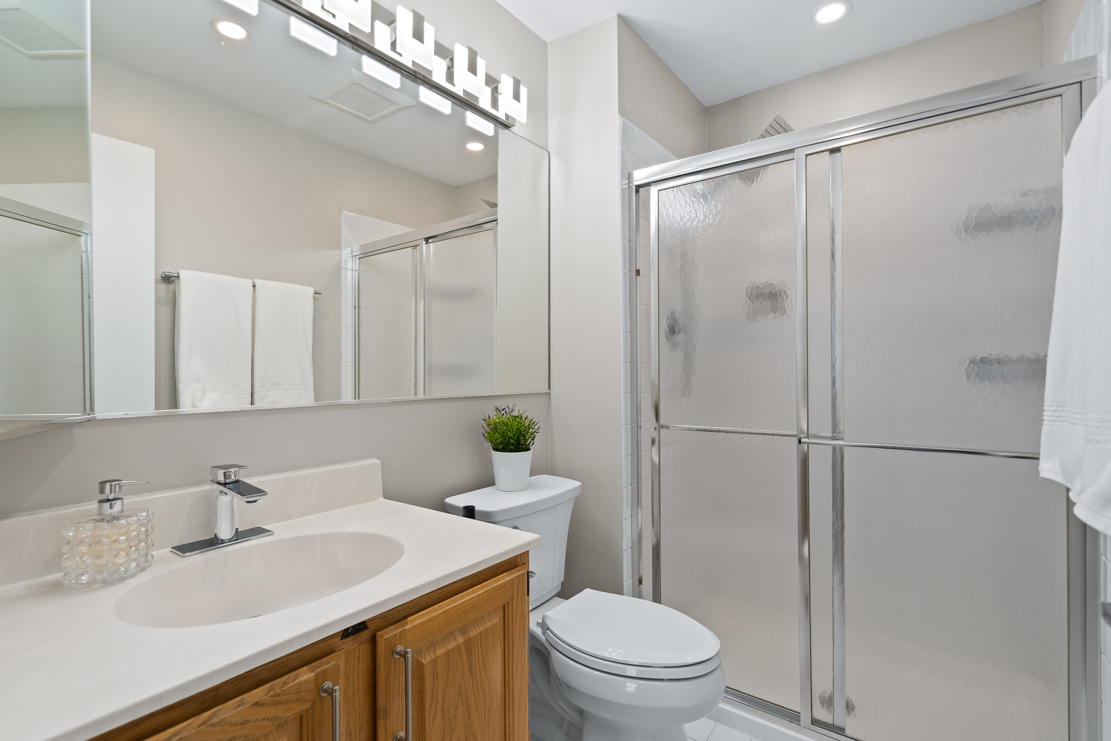1207 South Old Wilke Road, Unit 209 Rolling Meadows, IL 60005 - Photo 13 of 22 a bathroom with a sink toilet and shower