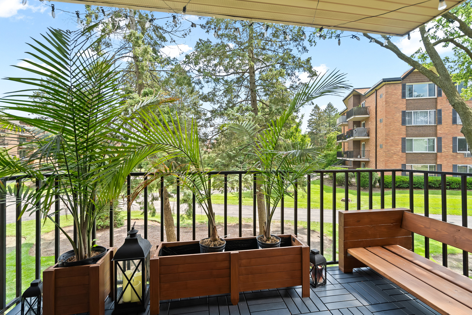 1207 South Old Wilke Road, Unit 209 Rolling Meadows, IL 60005 - Photo 16 of 22 a building outdoor space with patio furniture