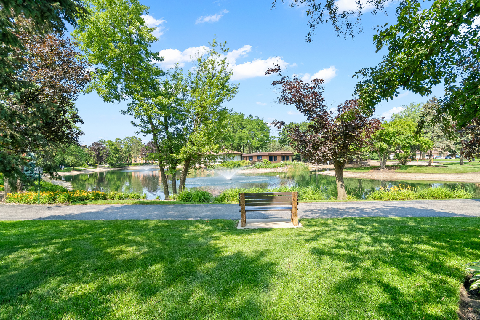 1207 South Old Wilke Road, Unit 209 Rolling Meadows, IL 60005 - Photo 17 of 22 a park view with a bench
