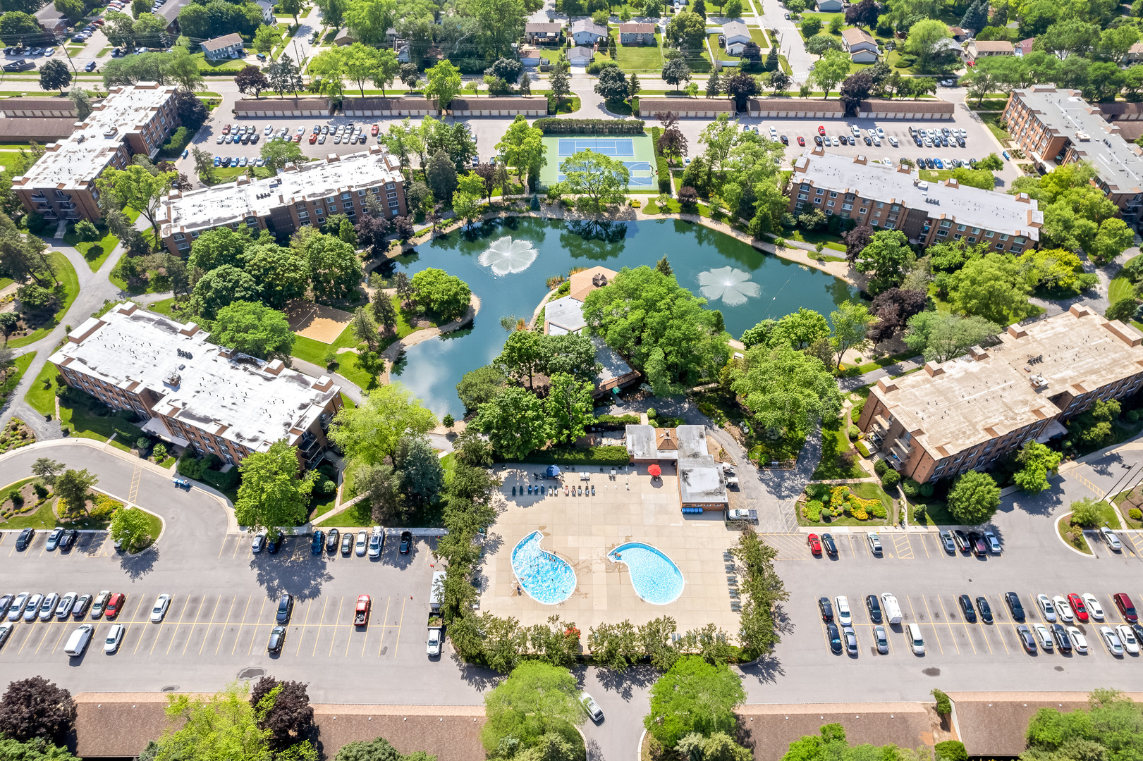 1207 South Old Wilke Road, Unit 209 Rolling Meadows, IL 60005 - Photo 21 of 22 an aerial view of a house with a swimming pool outdoor seating and yard