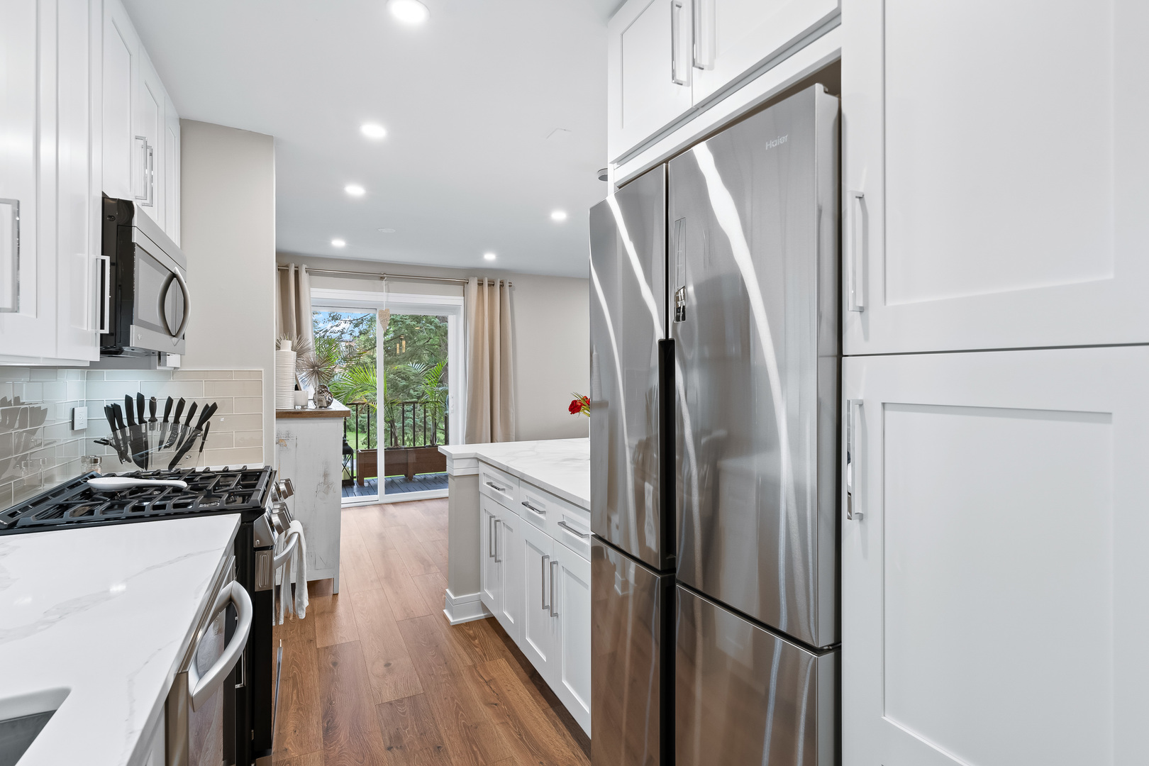 1207 South Old Wilke Road, Unit 209 Rolling Meadows, IL 60005 - Photo 5 of 22 a kitchen with stainless steel appliances a refrigerator sink and white cabinets