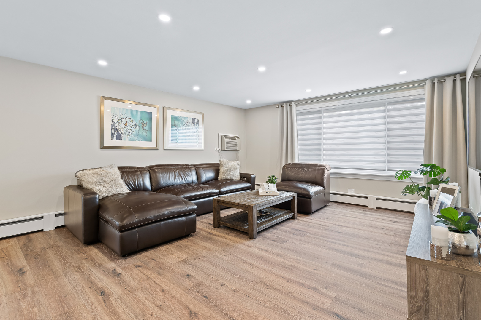 1207 South Old Wilke Road, Unit 209 Rolling Meadows, IL 60005 - Photo 7 of 22 a living room with furniture and a potted plant