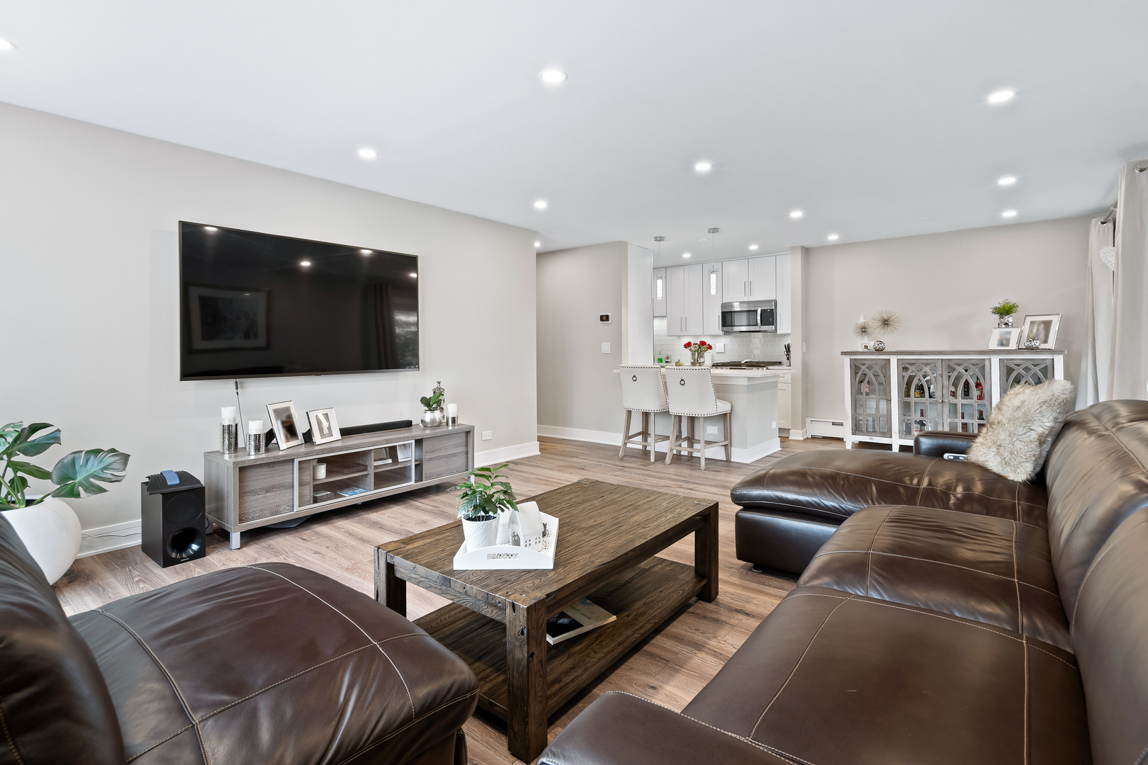 1207 South Old Wilke Road, Unit 209 Rolling Meadows, IL 60005 - Photo 8 of 22 a living room with furniture and a flat screen tv