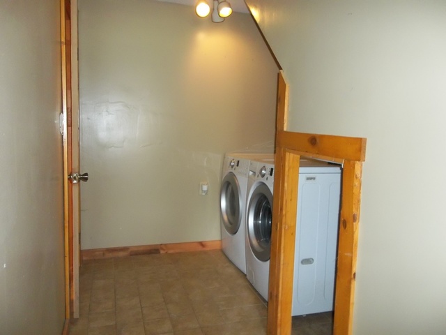 3588 South Butternut Road Oregon, IL 61061 - Photo 14 of 30 a view of a storage & utility room with a washer and dryer