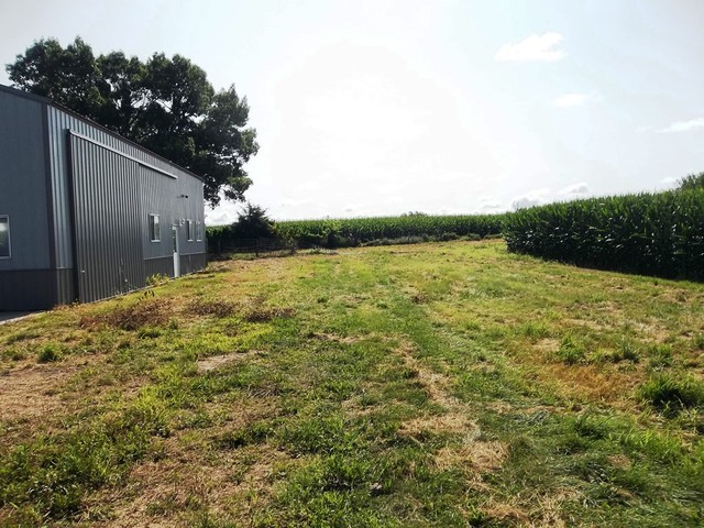 3588 South Butternut Road Oregon, IL 61061 - Photo 22 of 30 a backyard of a house with lots of green space