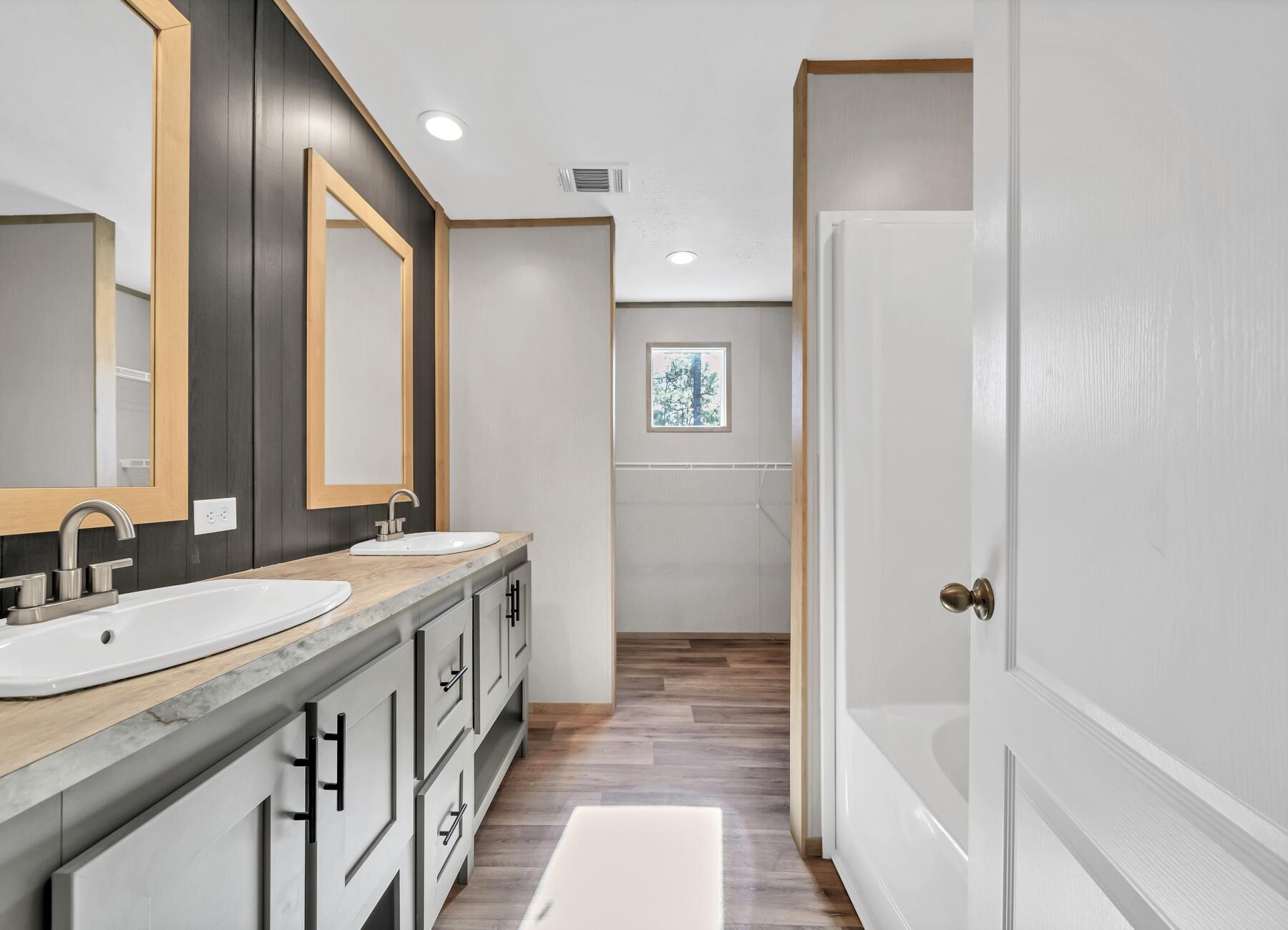 35 North Sally Jean Road DeFuniak Springs, FL 32433 - Photo 11 of 29 a bathroom with a double vanity sink and a mirror