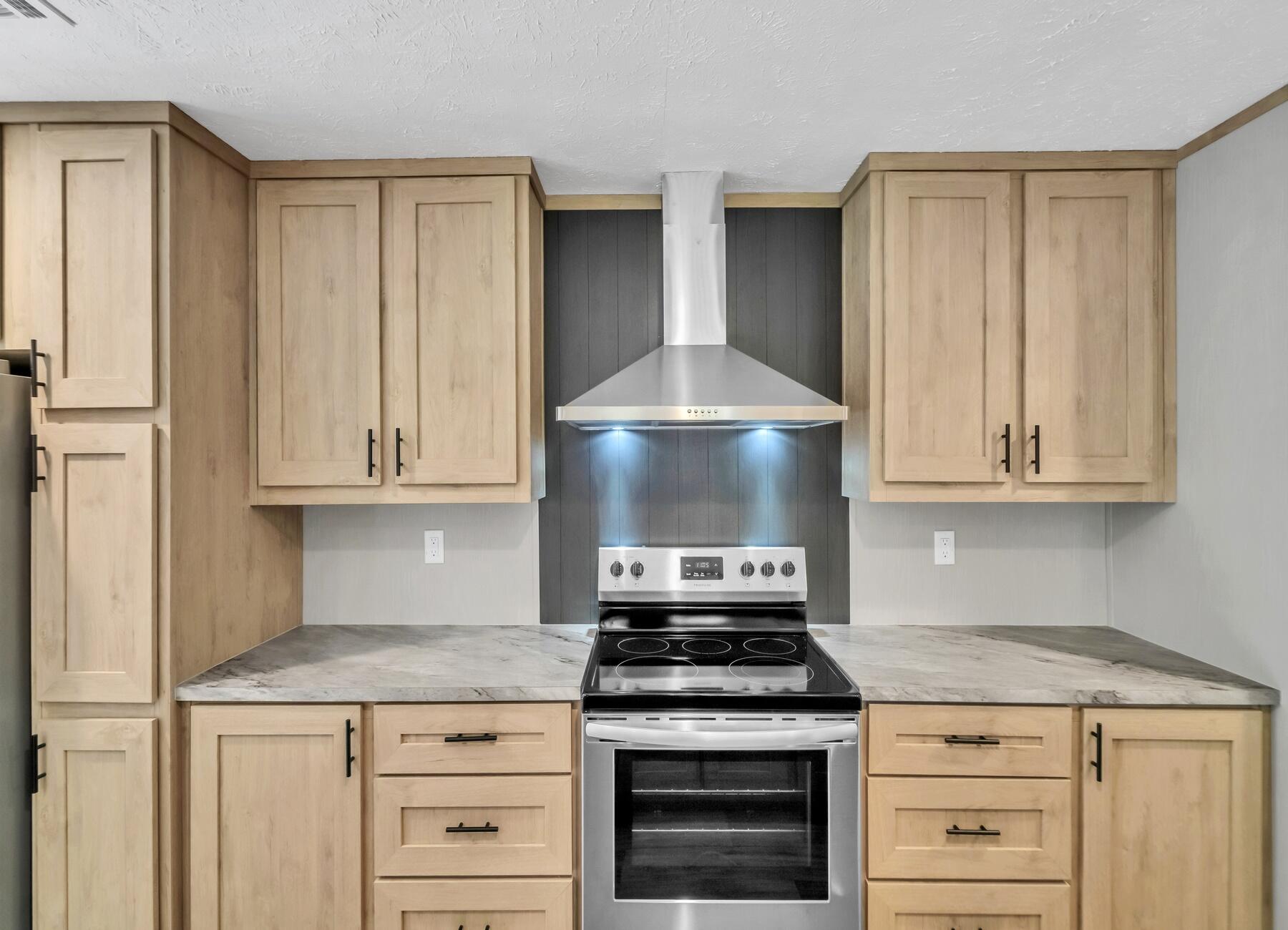 35 North Sally Jean Road DeFuniak Springs, FL 32433 - Photo 23 of 29 a kitchen with granite countertop a stove and a sink