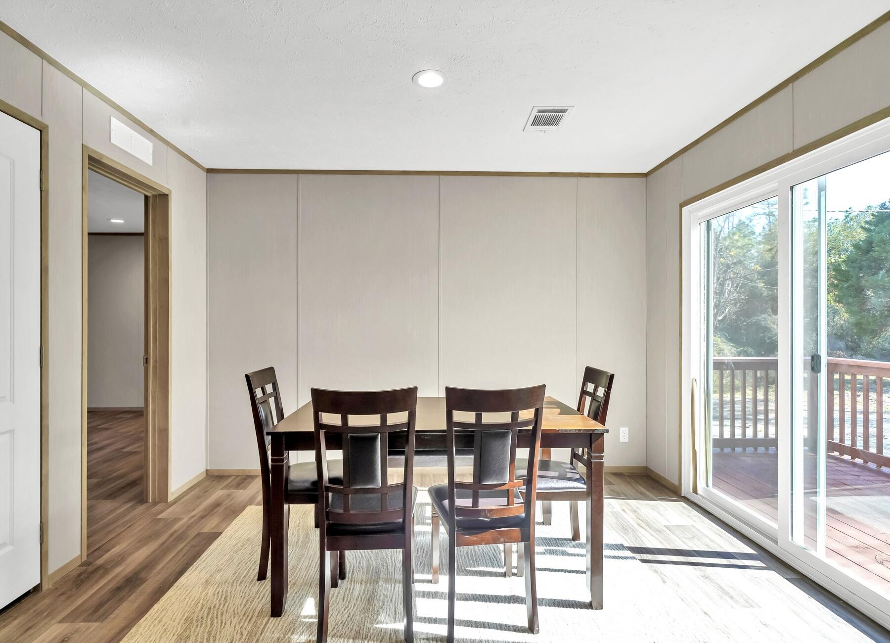 35 North Sally Jean Road DeFuniak Springs, FL 32433 - Photo 6 of 29 a view of a dining room with furniture window and outside view