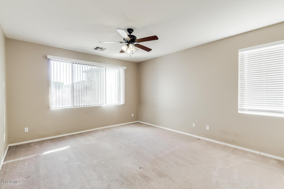 15917 West Calavar Road Surprise, AZ 85379 - Photo 15 of 40 a view of an empty room with a window