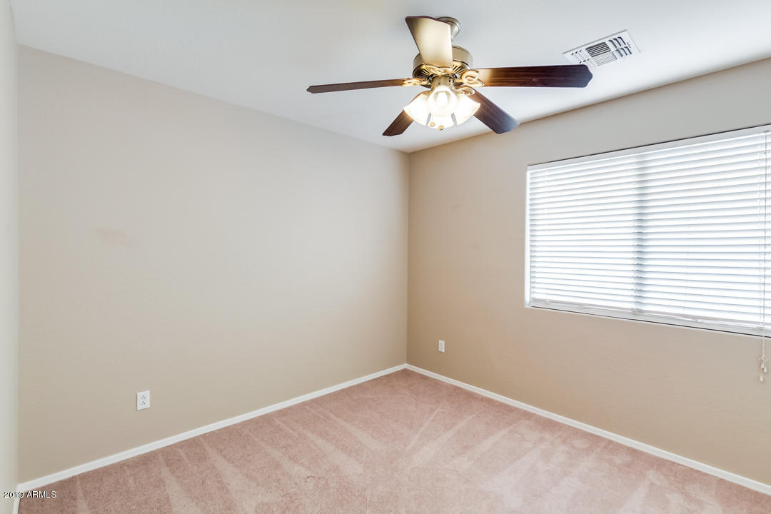 15917 West Calavar Road Surprise, AZ 85379 - Photo 23 of 40 a view of an empty room with a window