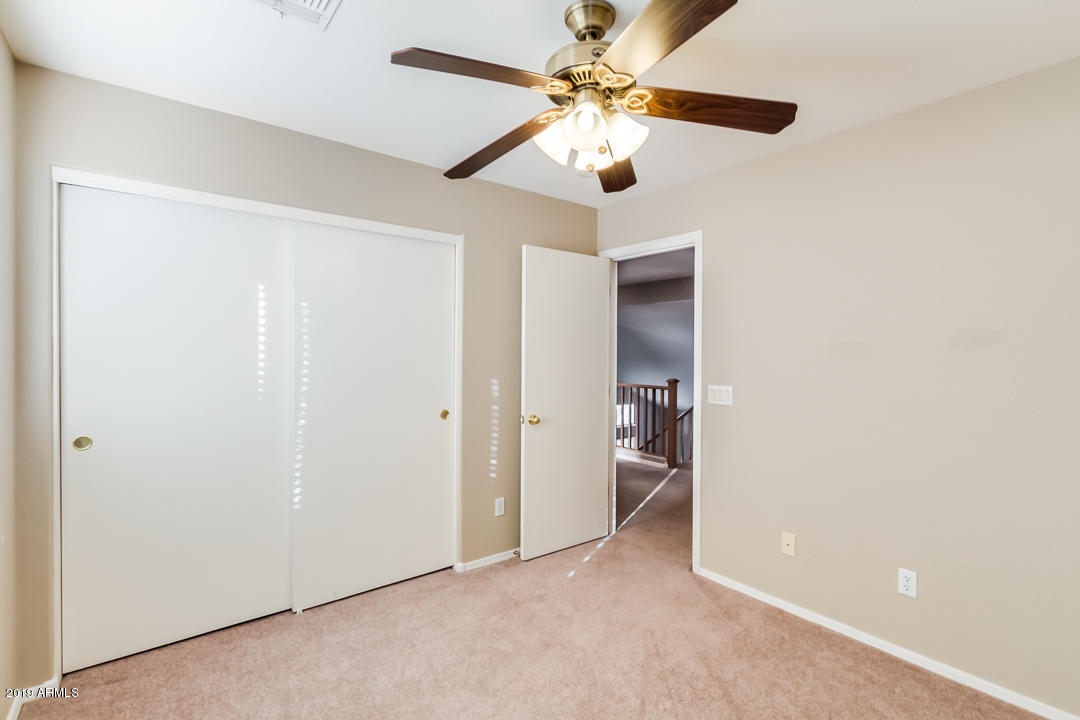 15917 West Calavar Road Surprise, AZ 85379 - Photo 24 of 40 wooden floor in an empty room with a window