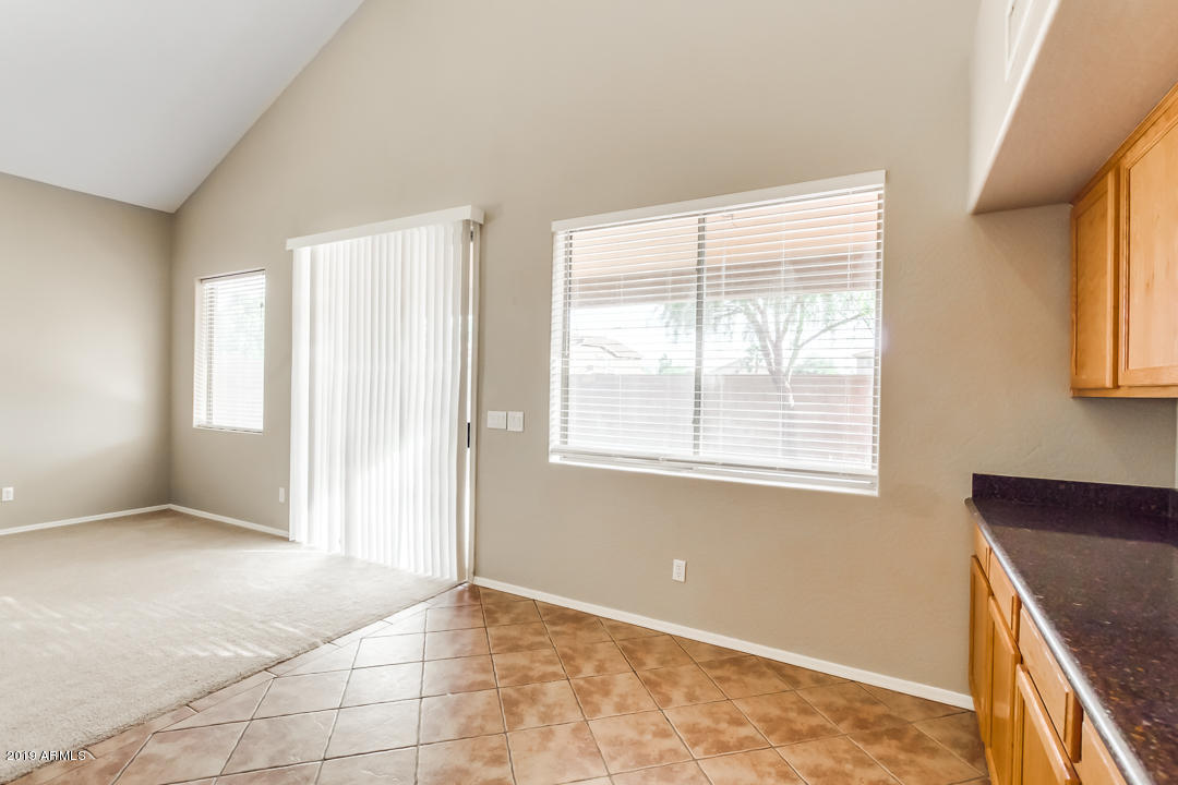 15917 West Calavar Road Surprise, AZ 85379 - Photo 38 of 40 an empty room with windows