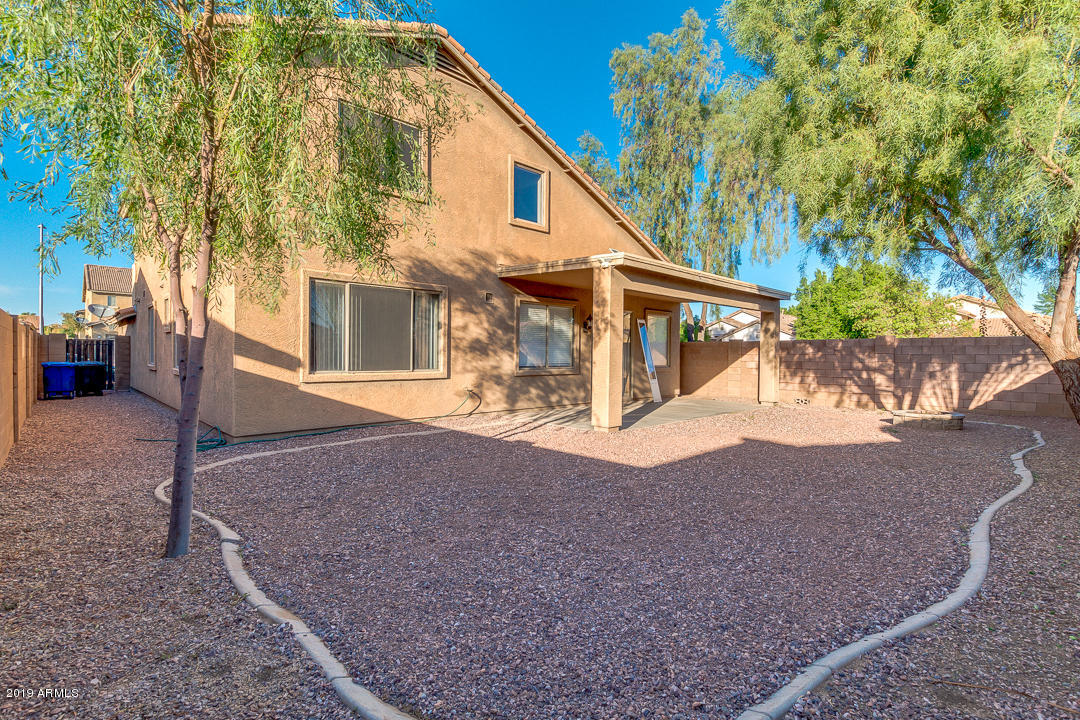 15917 West Calavar Road Surprise, AZ 85379 - Photo 5 of 40 a view of a house with a yard
