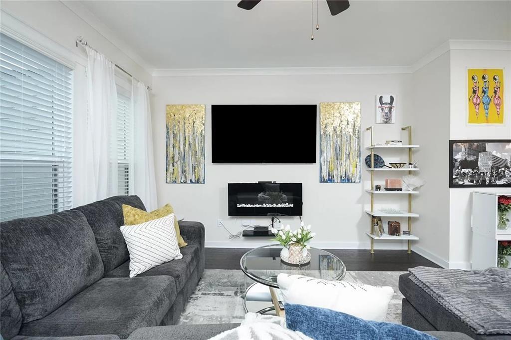 2048 Holtz Lane Atlanta, GA 30318 - Photo 11 of 27 a living room with furniture and a flat screen tv