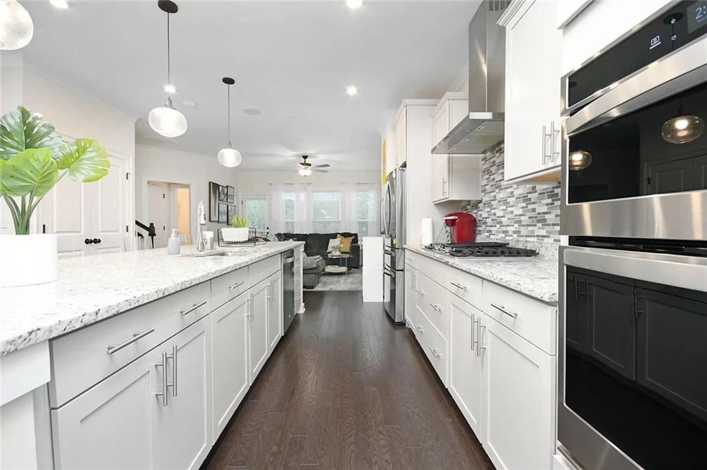 2048 Holtz Lane Atlanta, GA 30318 - Photo 12 of 27 a large kitchen with granite countertop lots of counter space and a sink