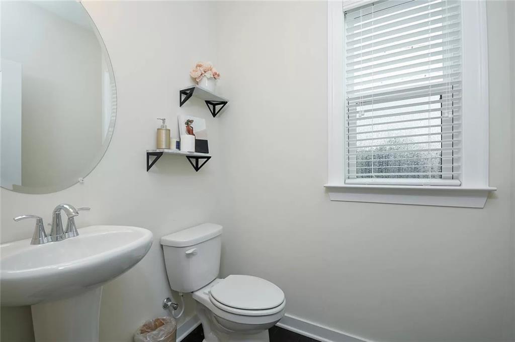 2048 Holtz Lane Atlanta, GA 30318 - Photo 15 of 27 a bathroom with a sink mirror and toilet