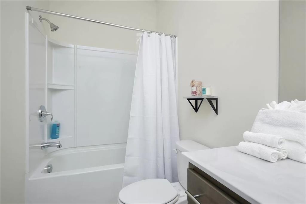 2048 Holtz Lane Atlanta, GA 30318 - Photo 16 of 27 a bathroom with a sink toilet and shower