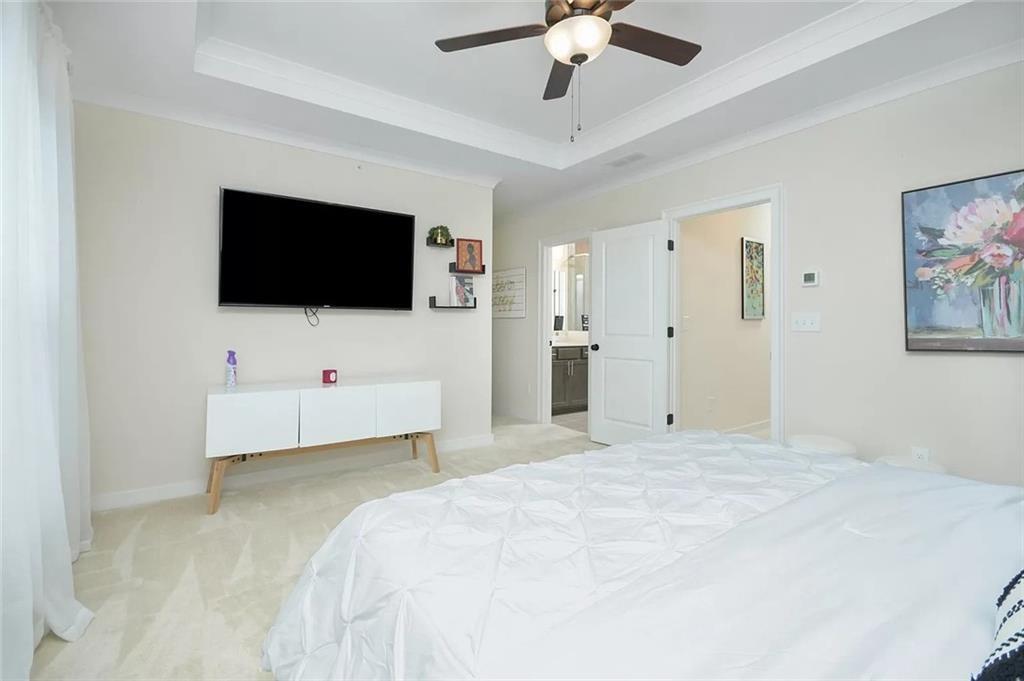 2048 Holtz Lane Atlanta, GA 30318 - Photo 17 of 27 a bedroom with a bed window and a flat screen tv