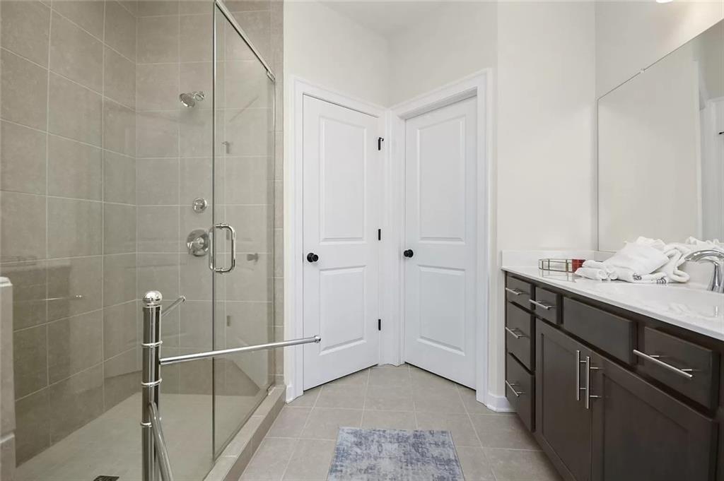 2048 Holtz Lane Atlanta, GA 30318 - Photo 23 of 27 a bathroom with a sink and mirror
