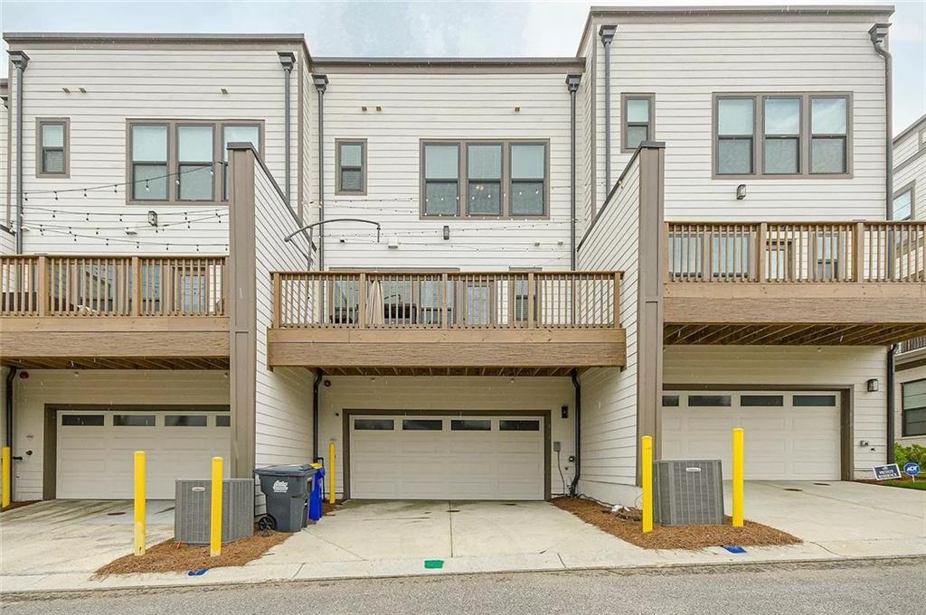 2048 Holtz Lane Atlanta, GA 30318 - Photo 27 of 27 a front view of a building with a garage