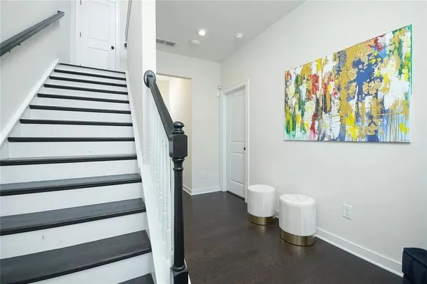 a bathroom with a toilet and a shower curtain