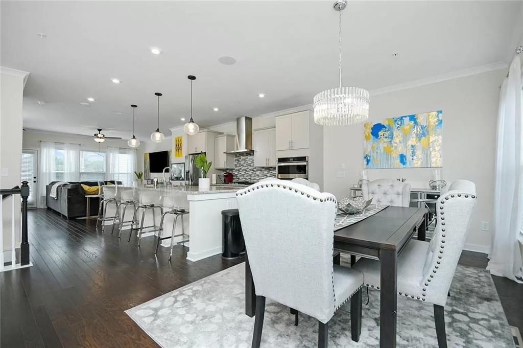 2048 Holtz Lane Atlanta, GA 30318 - Photo 7 of 27 a view of a dining room with furniture and wooden floor