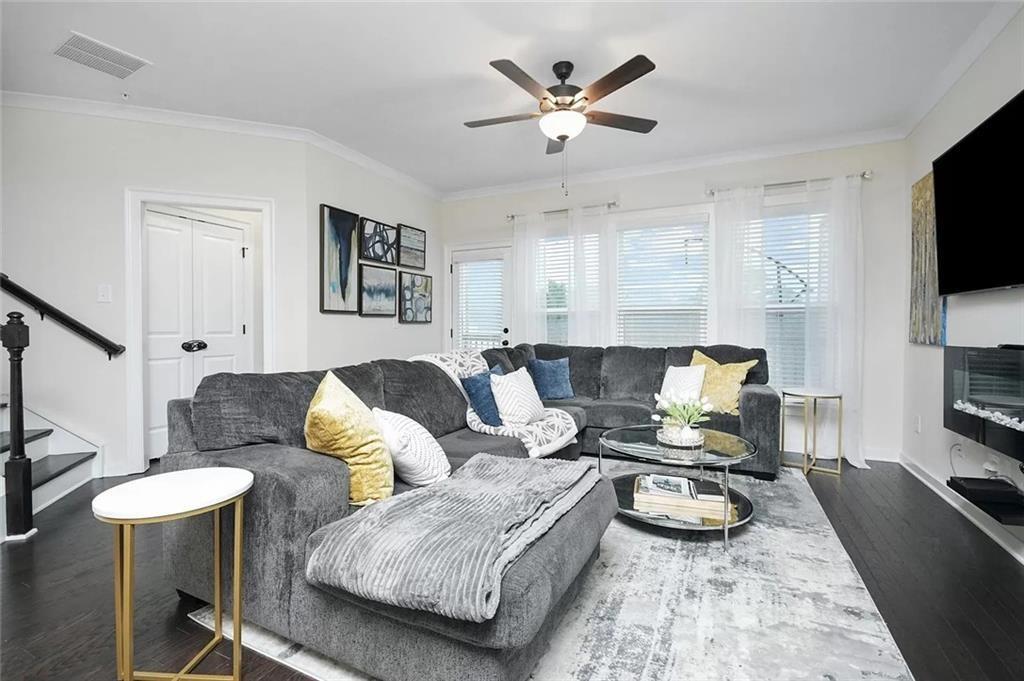2048 Holtz Lane Atlanta, GA 30318 - Photo 10 of 27 a living room with furniture and a flat screen tv