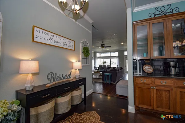 a kitchen with sink cabinets and wooden floor