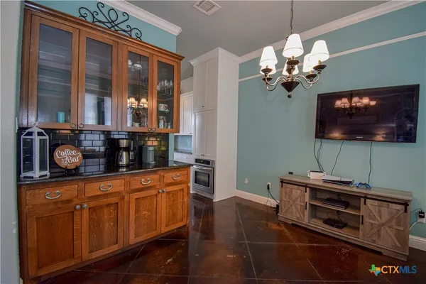 a kitchen with stainless steel appliances granite countertop a stove and a microwave