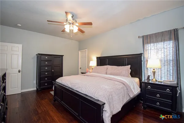 a bathroom with a sink vanity and mirror