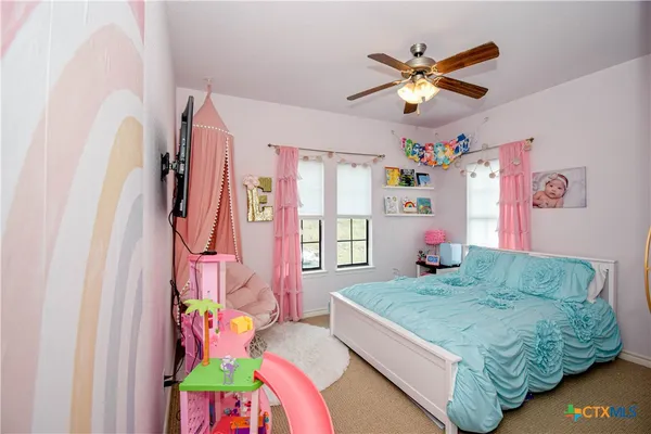 a white toilet sitting next to a shower curtain