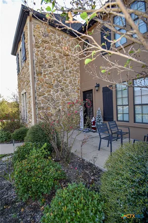 a view of a building with a bench and table chair