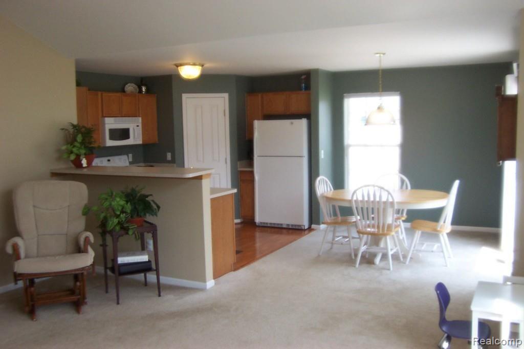 4257 Hampton Ridge Boulevard, Unit 132 Howell, MI 48843 - Photo 6 of 22 living, dining, kitchen