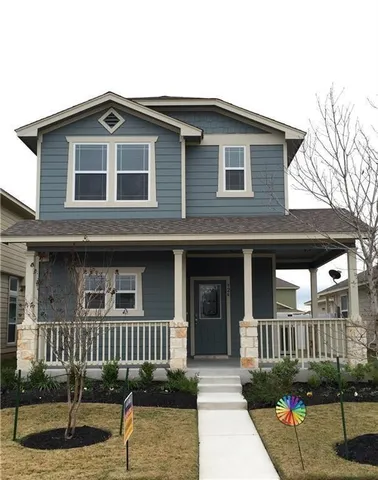a front view of a house with garage