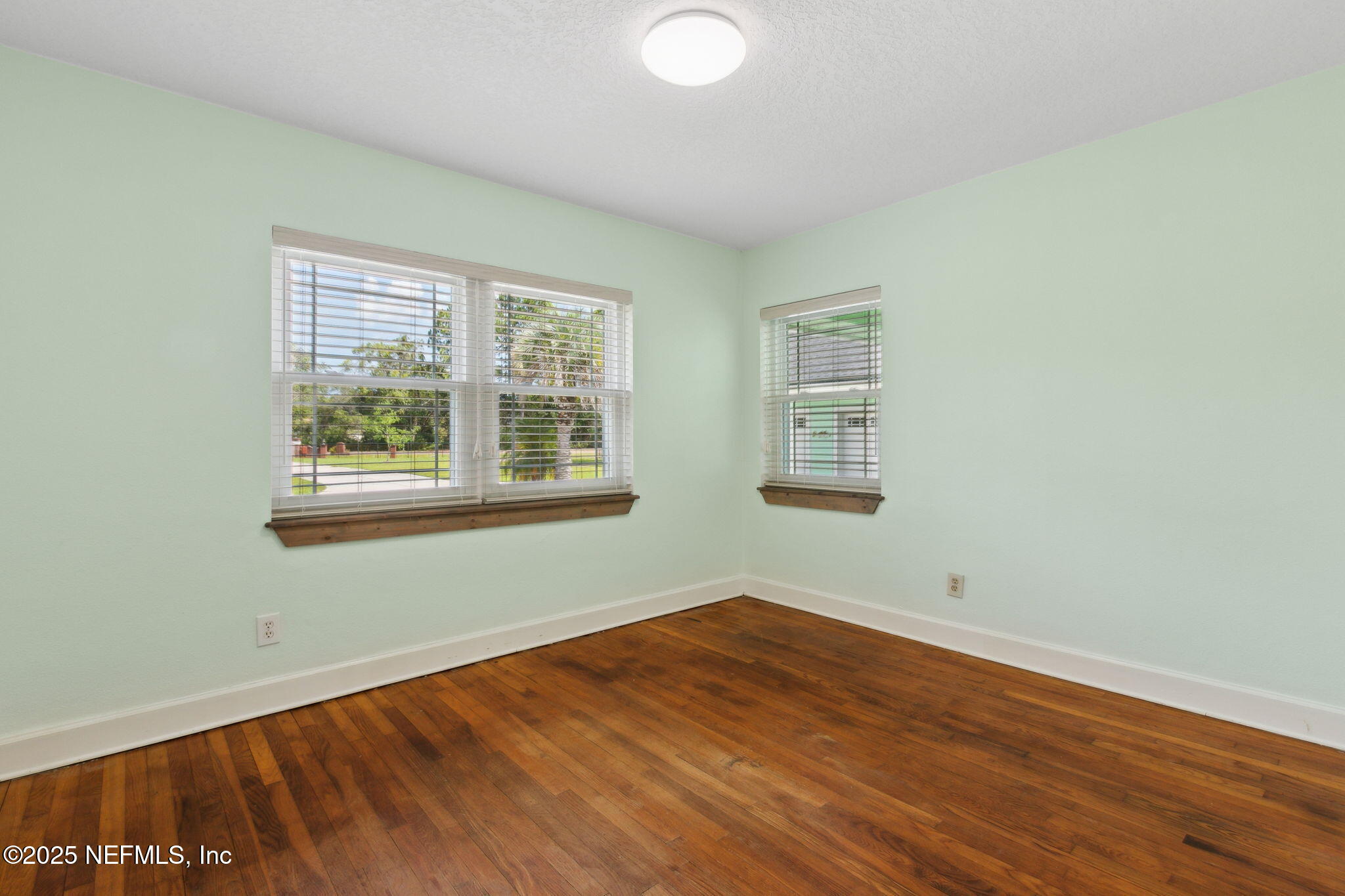 16062 Shark Road West Jacksonville, FL 32226 - Photo 15 of 43 a view of a room with wooden floor and windows