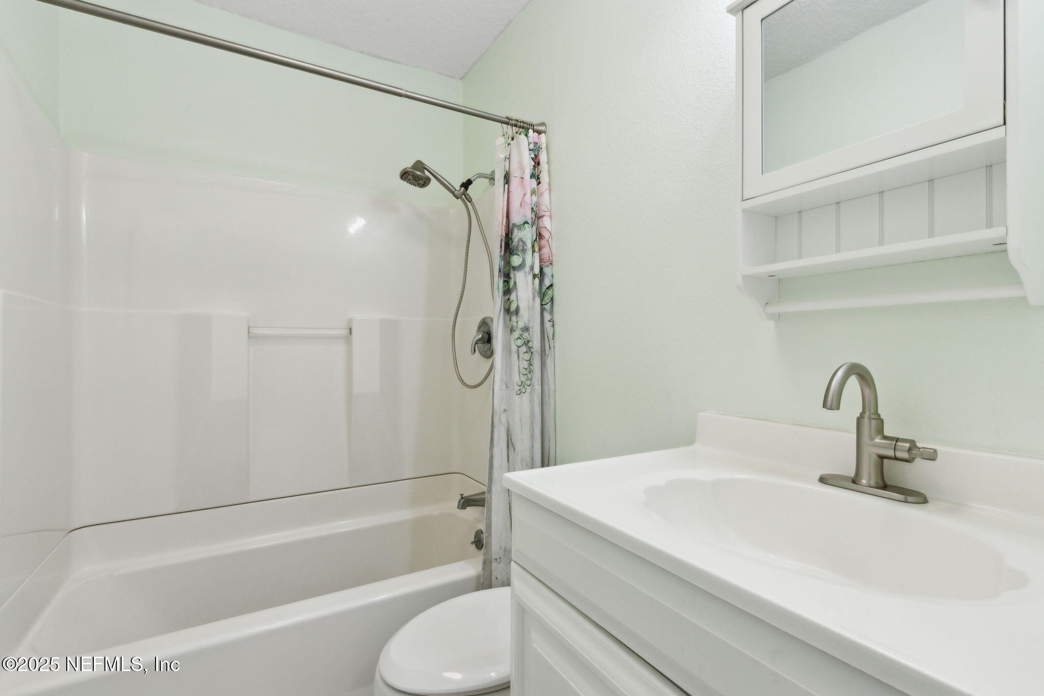 16062 Shark Road West Jacksonville, FL 32226 - Photo 17 of 43 a bathroom with a granite countertop sink a toilet and shower